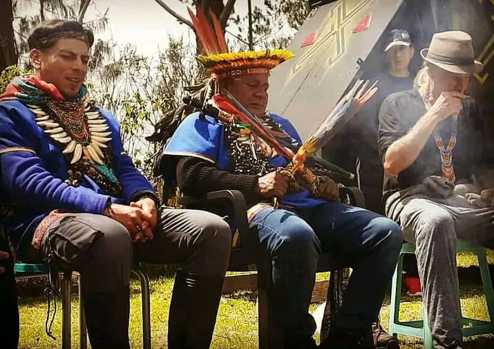 Taita and apprentice in ceremony around the sacred fire