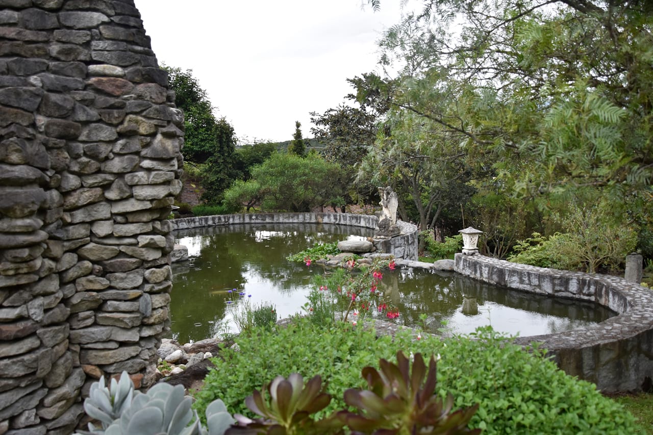 Stone pond and gardens at Teos Center